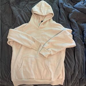 Cream Pullover Hoodie with Ribbed Cuffs and Relaxed Fit